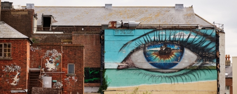 Large Blue eye Artwork onside of building.Southsea Common Artwork - City Guide 2022