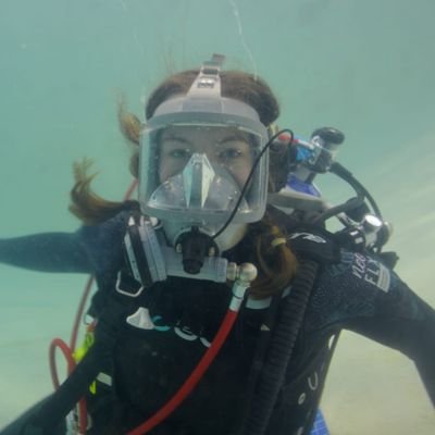 Photo of Daisy Turnbull underwater in diving gear