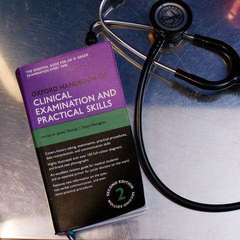 clinical health book and stethoscope