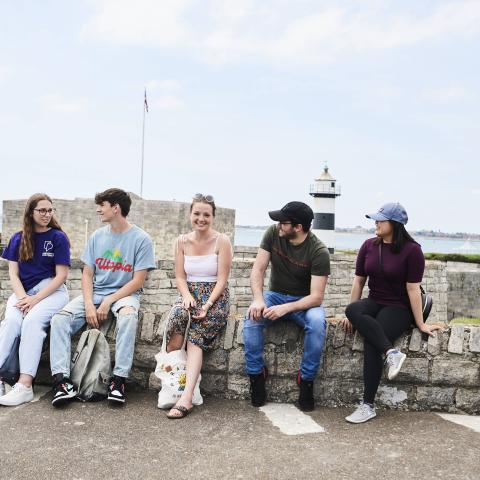 Students sat by Southsea Castle portsmouth