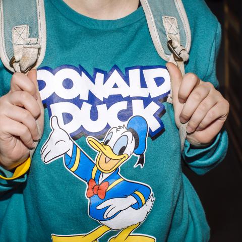 Young woman wearing Donald Duck sweatshirt