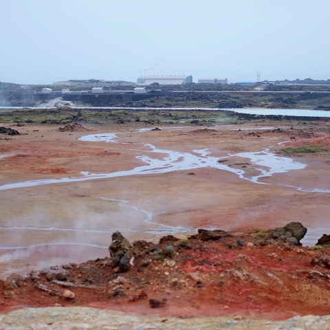 Red and orange geothermal area with hot springs