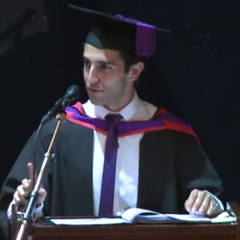 Image of Portsmouth graduate Niosha Kayhani giving a speech during graduation
