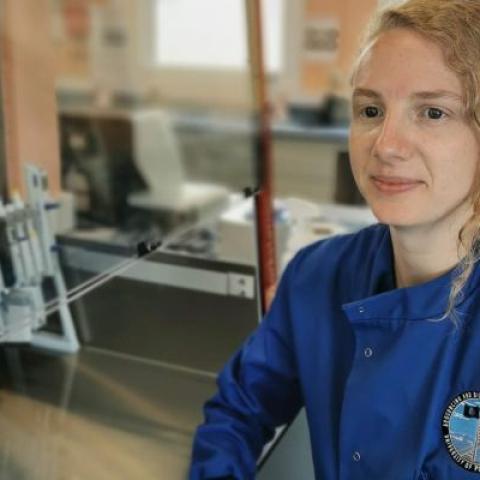 Angie Beckett in blue lab coat