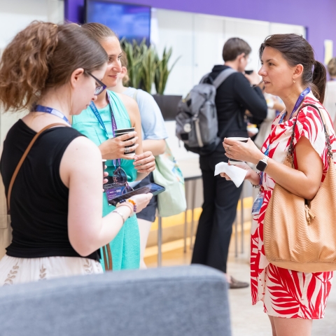 Conference delegates chatting over refreshments
