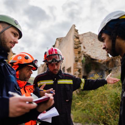 Structural engineers in disaster relief training in earthquake ruins