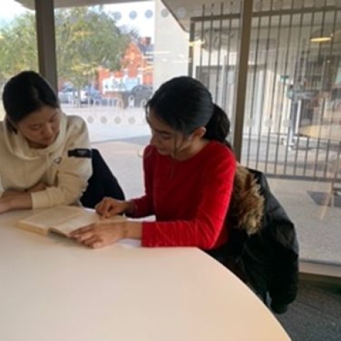 Eunsoo Choi reading with a child