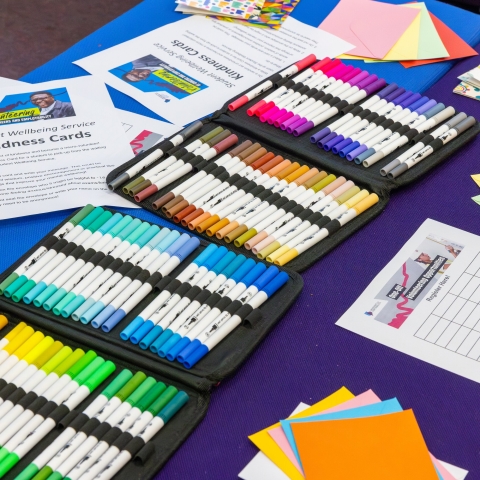 Sets of coloured pens and wellbeing worksheets 
