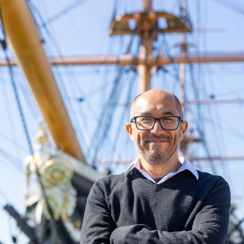 Carlos Ausejo in Portsmouth in front of HMS Warrior - a pioneering iron-hulled ship, launched in 1860, and powered by steam and sail