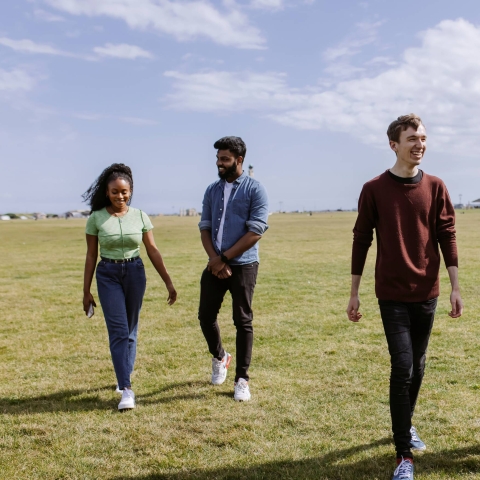 4 students in Southsea walking on the common