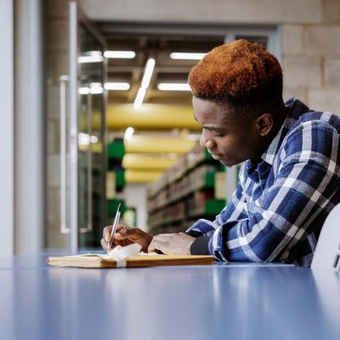 University of Portsmouth student in the library