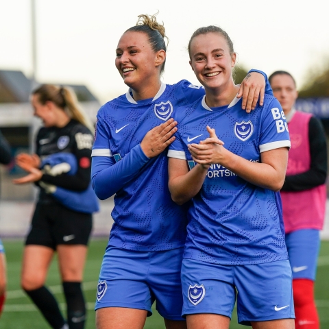 Two women in portsmouth FC uniform 