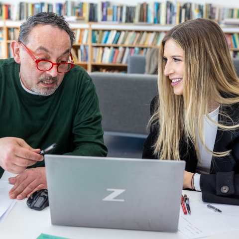 a teacher and student talking 