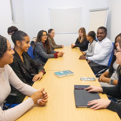 Group of students sat at a table