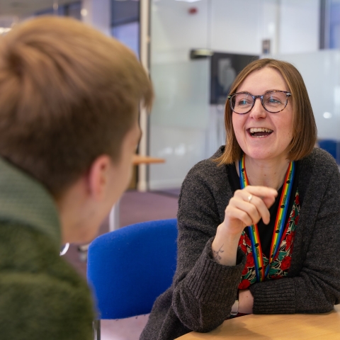 A Careers Advisor with a student, smiling 
