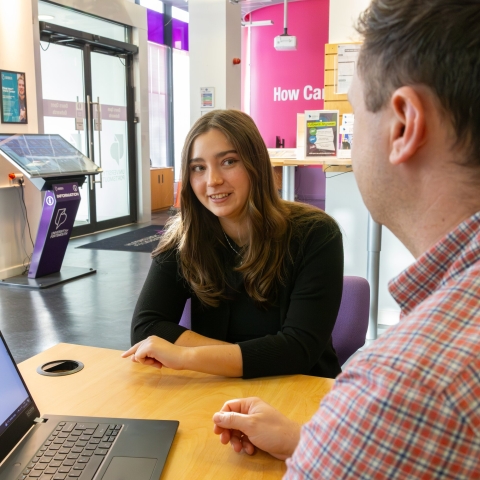A Careers adviser speaking to a student