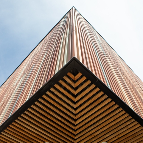 Wooden corner of the Ravelin Building with symmetrical panels