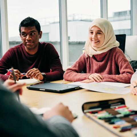 People sat around a table 