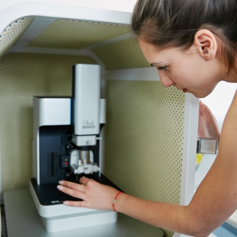 Student working with Atomic Force microscope