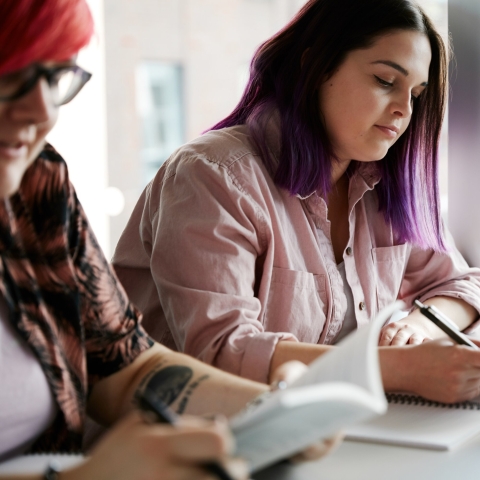 Two women studying