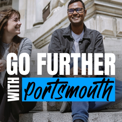 Two postgraduate students laughing on the Guildhall steps