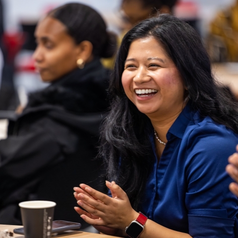 Two students, one laughing