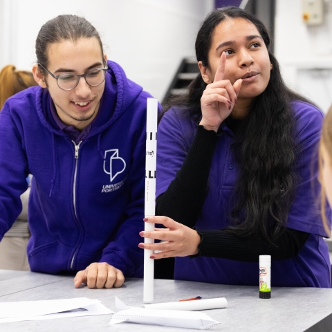 Two University of Portsmouth outreach officers at a college event