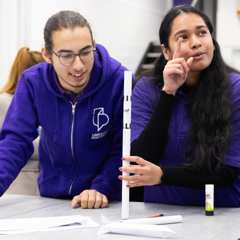 Two University of Portsmouth outreach officers at a college event