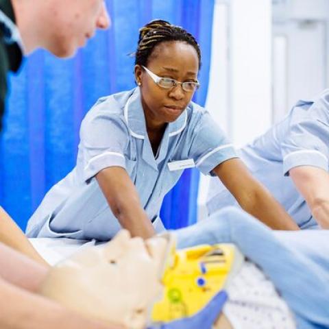 Paramedic and students nurses working in simulation ward.