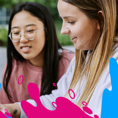 Two female students viewing a webinar