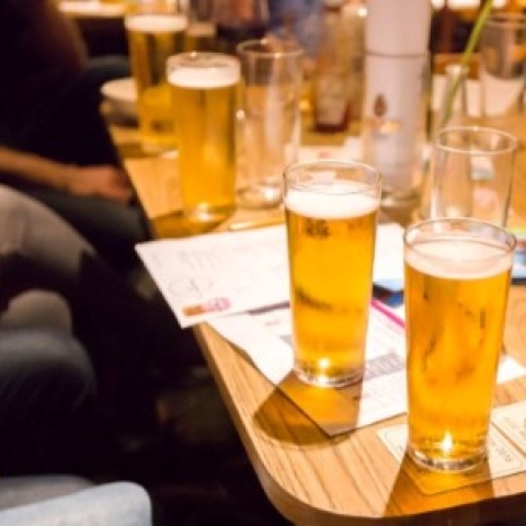 beer glasses on a table in a bar