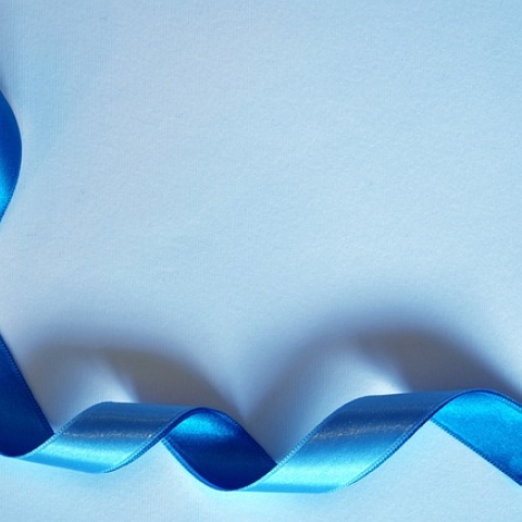 A blue ribbon used to signify prostate cancer awareness