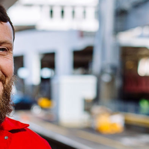 A smiling man with beard wearing WightLink uniform