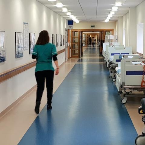 Healthcare worker in hospital corridor