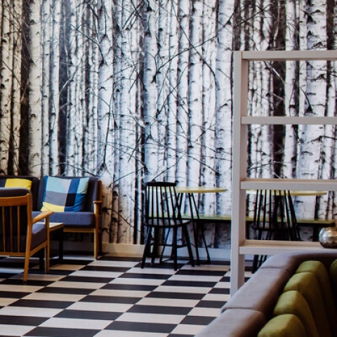 A foam partition with a chair emerging from behind it