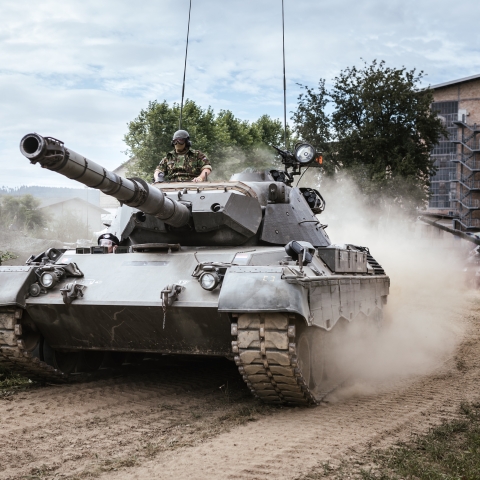 Military tank with soldiers - Photo by Kevin Schmid on Unsplash 
