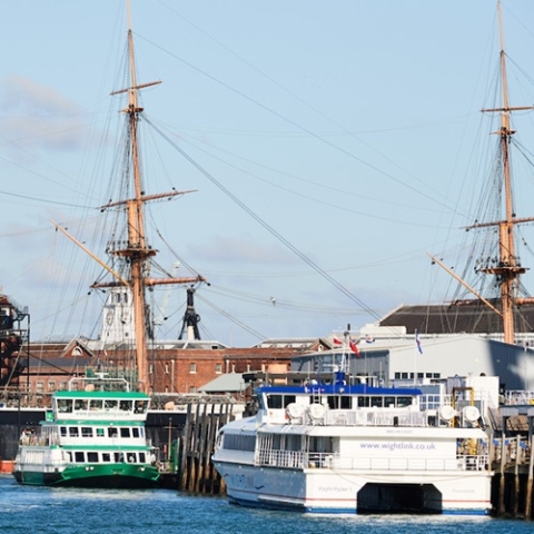 Portsmouth Harbour with historic dockyard ships and ferries