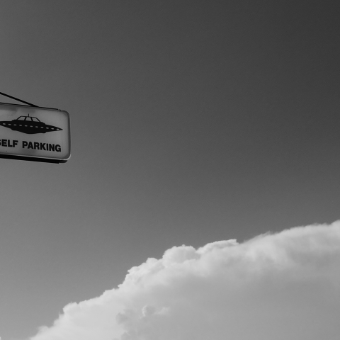 Sign with UFO parking on it - Photo by Michael Herren on Unsplash