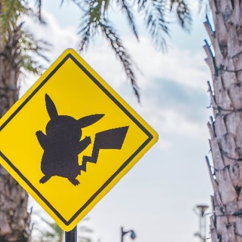 Yellow traffic sign with black shadow of Pikachu - Photo by Roméo A. on Unsplash