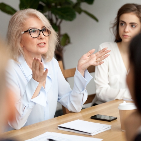 Image of three woman sat talking to eachother