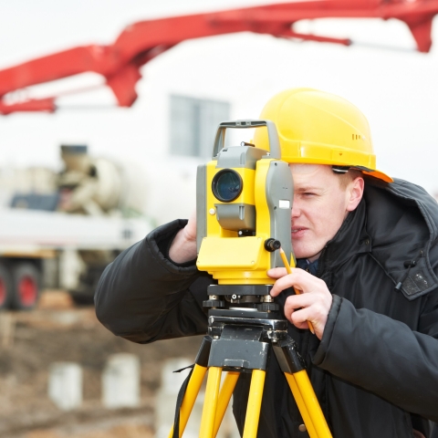 Student using surveying equipment