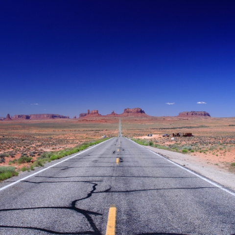 Road leading away from viewer in Monument Valley