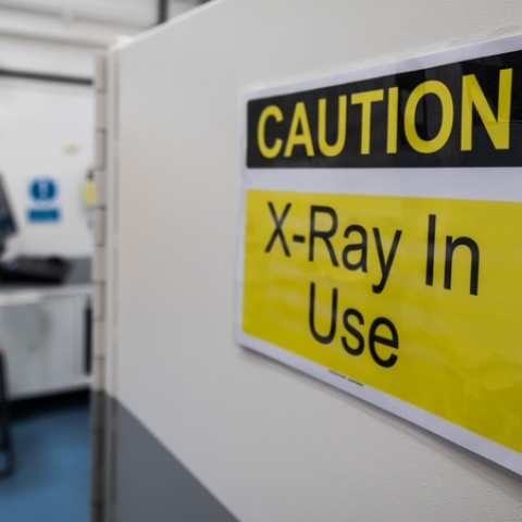 warning sign on the side of an x-ray machine