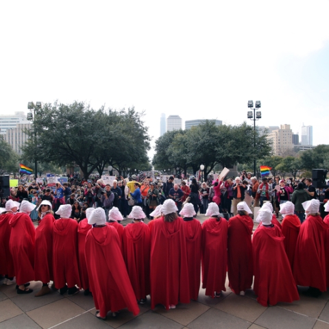 Group of women protesting dressed as characters from The Handmaids Tale