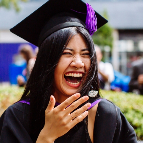 Student laughing at graduation