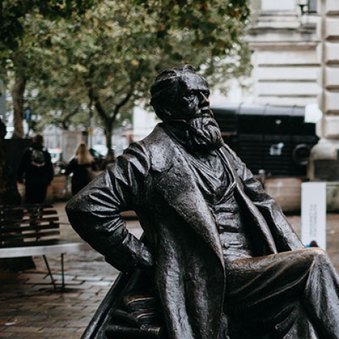 Literary figure stature Charles Dickens in Guildhall Square