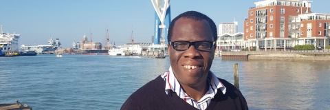 Andrew Nomoja in front of the Spinnaker Tower