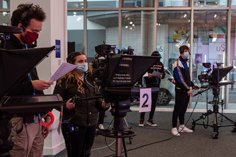 Students using cameras in the Pompey news set