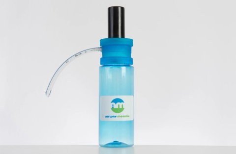 Blue medical suction device which is the size of a sports bottle