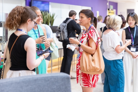 Conference delegates chatting over refreshments
